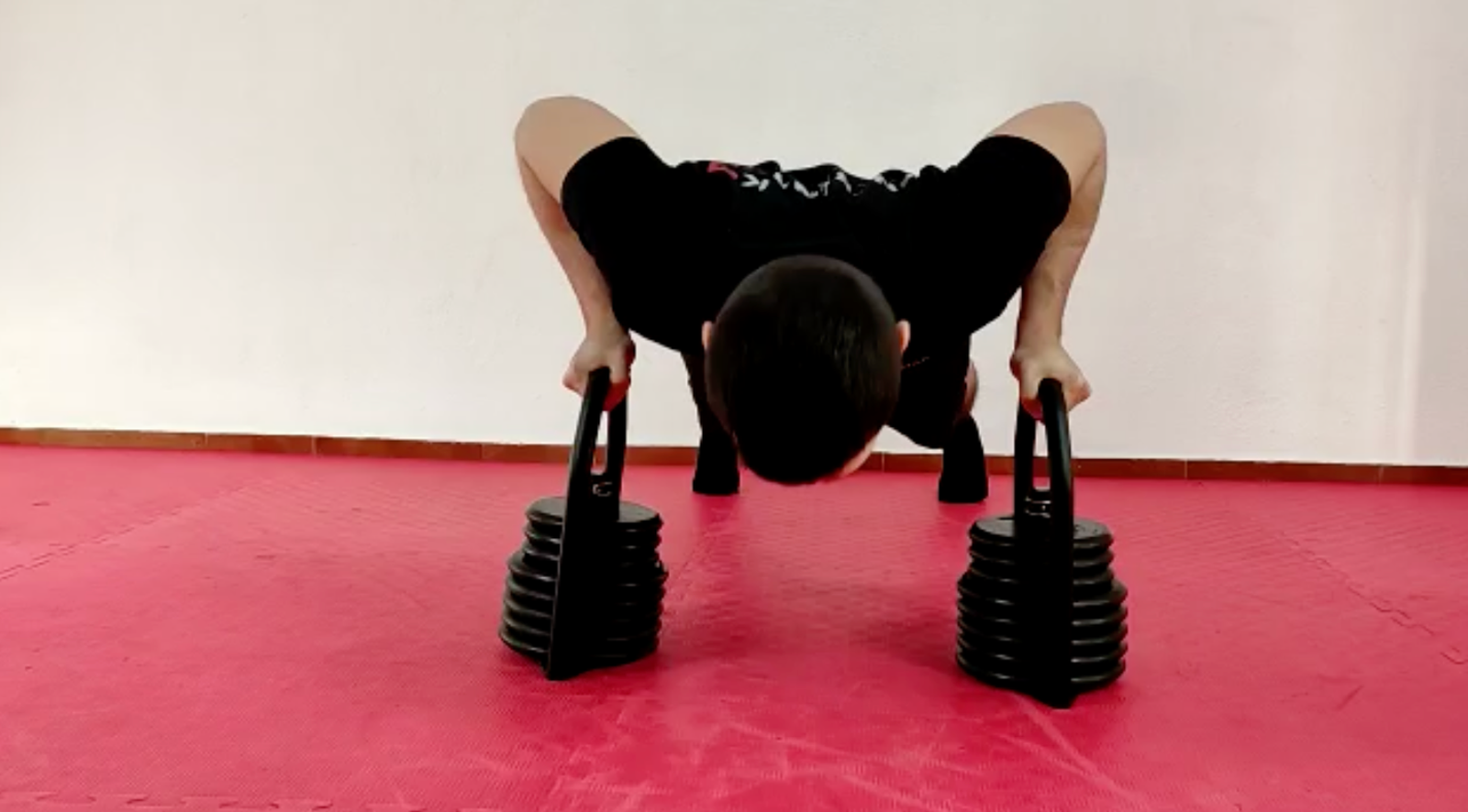 Double kettlebell push-up position with two Regulabells